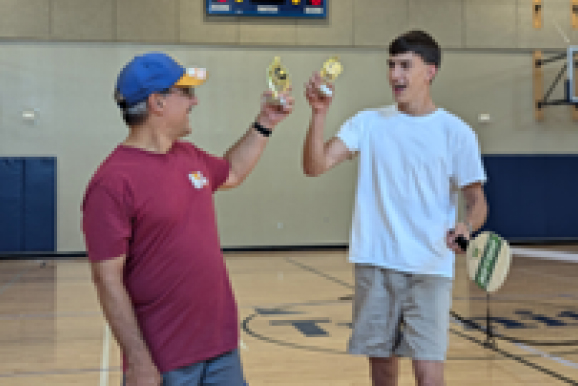 KELLYBRADY Pickleball champs Chris and Alex celebrate their victory