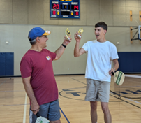 KELLYBRADY Pickleball champs Chris and Alex celebrate their victory. 